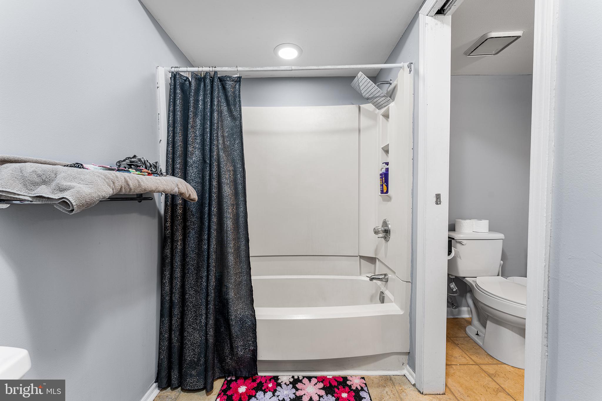 16 Devon Place Sewell, NJ 08080 - Photo 17 of 22 a bathroom with a bathtub and a shower