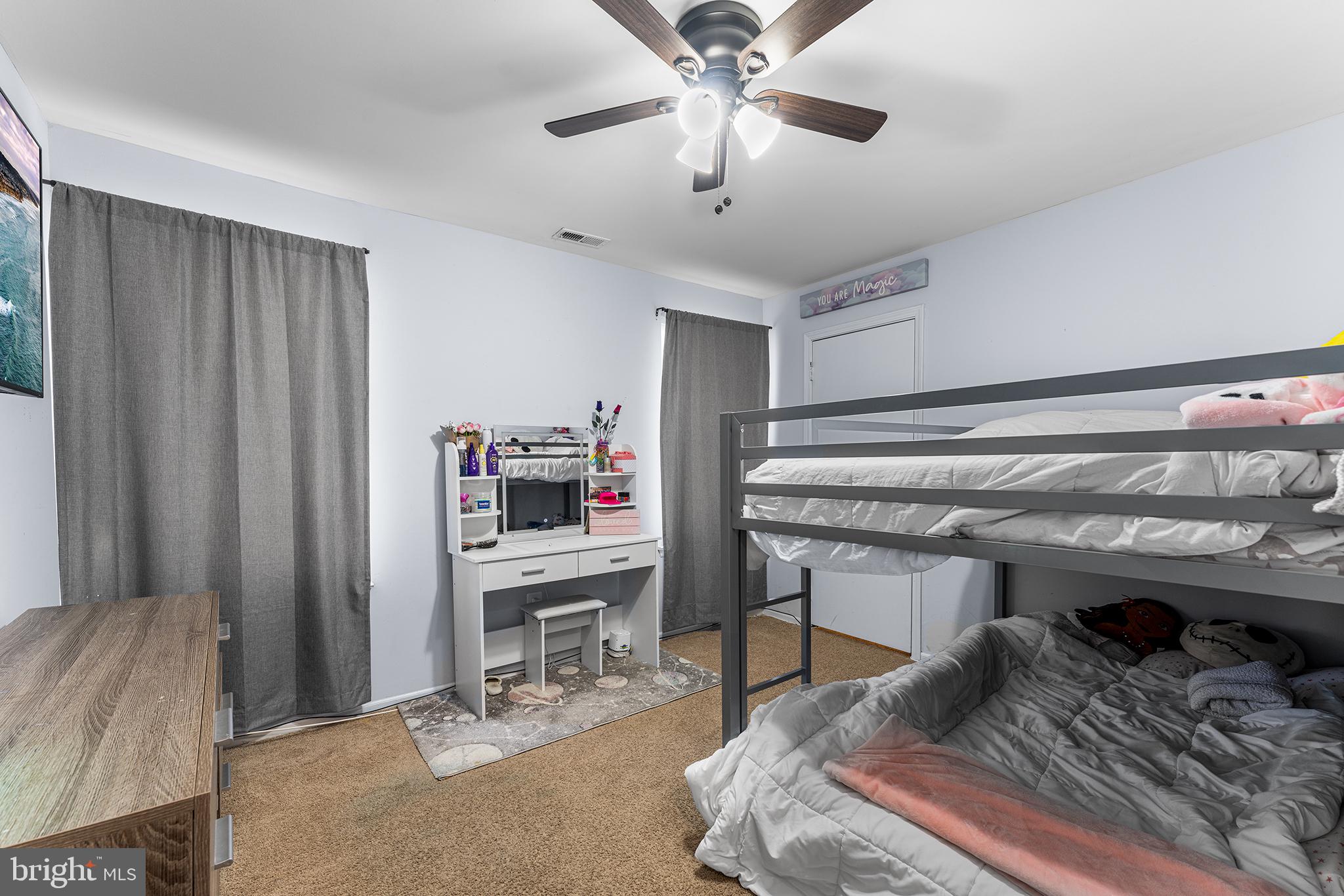 16 Devon Place Sewell, NJ 08080 - Photo 18 of 22 a bedroom with a bed and a chandelier