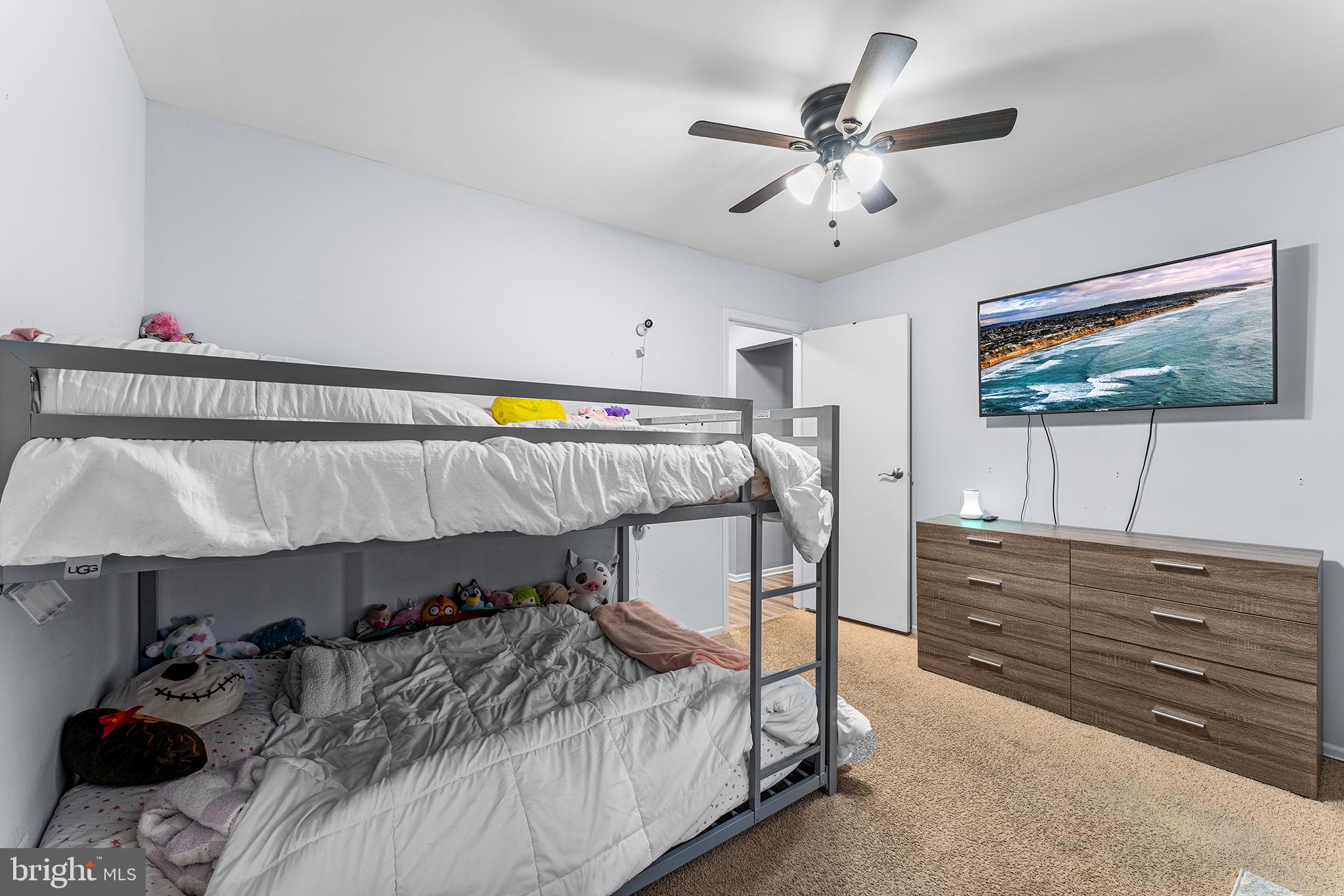 16 Devon Place Sewell, NJ 08080 - Photo 20 of 22 a bedroom with a bed and a chandelier