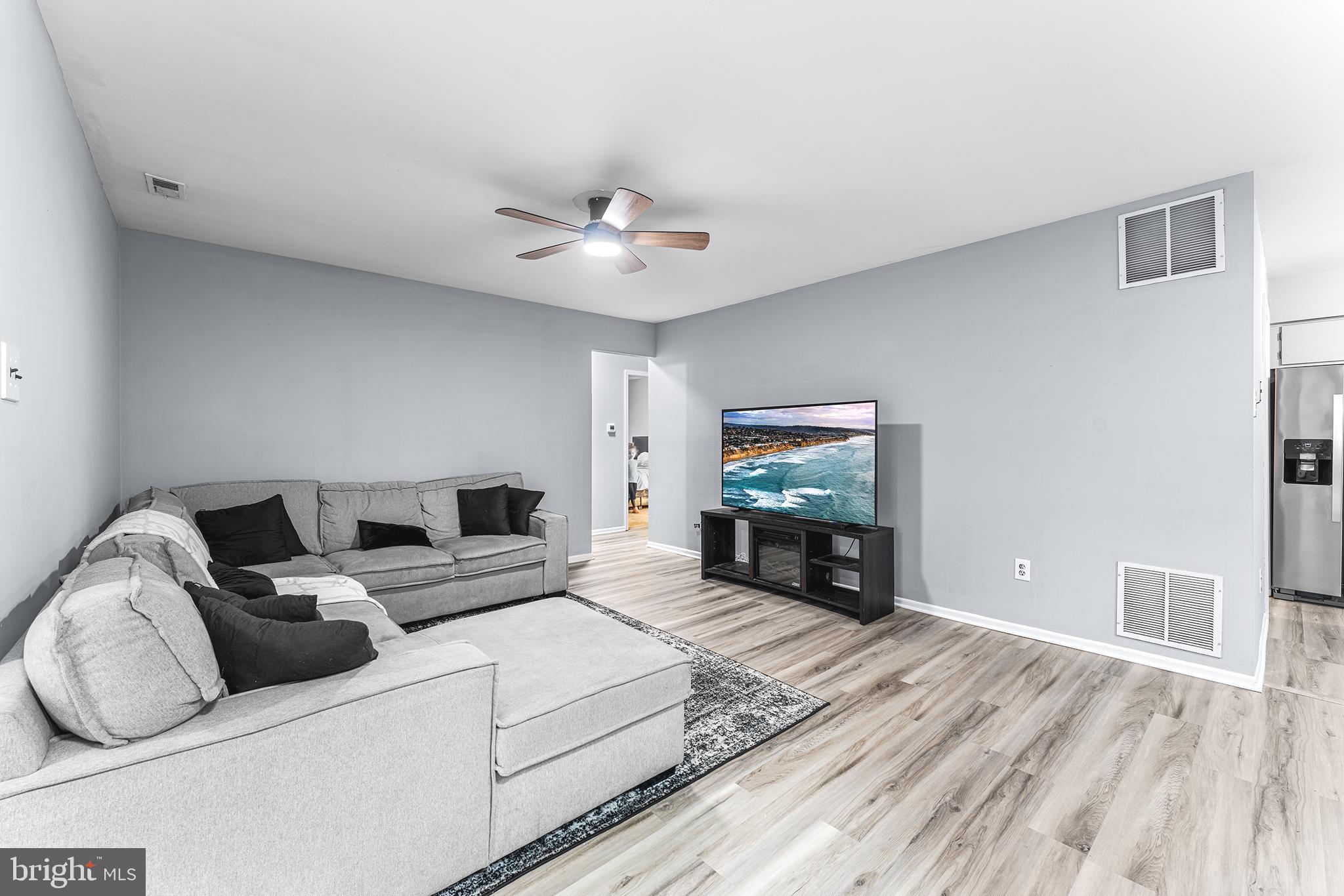 16 Devon Place Sewell, NJ 08080 - Photo 4 of 22 a living room with furniture and a flat screen tv