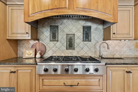a white stove top oven sitting inside of a kitchen
