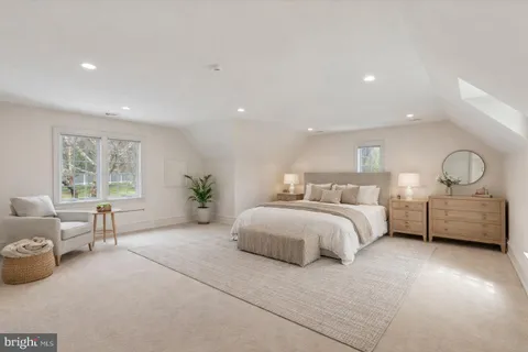 a bedroom with bed and window