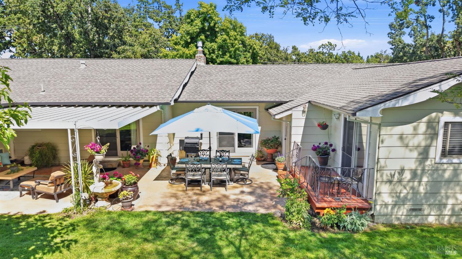 373 Piezzi Road Santa Rosa, CA 95401 - Photo 46 of 55 a view of a patio with table and chairs under an umbrella
