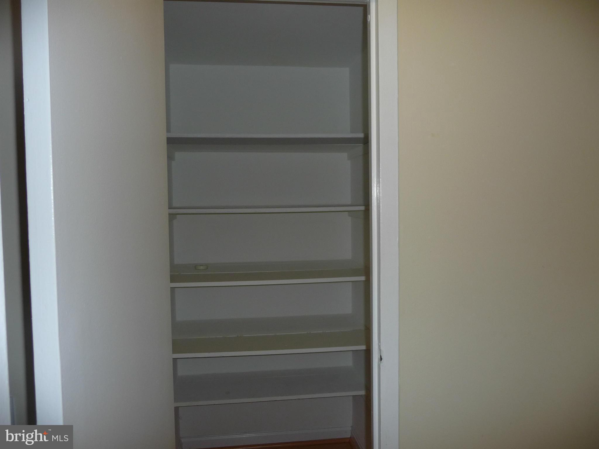 3820 Bel Pre Road, Unit 272 Silver Spring, MD 20906 - Photo 16 of 27 Storage Closet with shelving in Hall Near Kitchen
