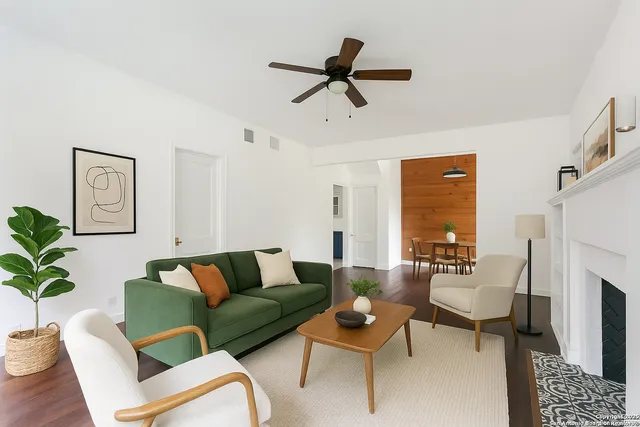 a living room with furniture and a fireplace