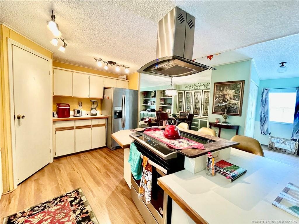 14623 Southwest Rake Drive Indiantown, FL 34956 - Photo 14 of 46 Large walk in pantry. New stove w/over the stove hood.