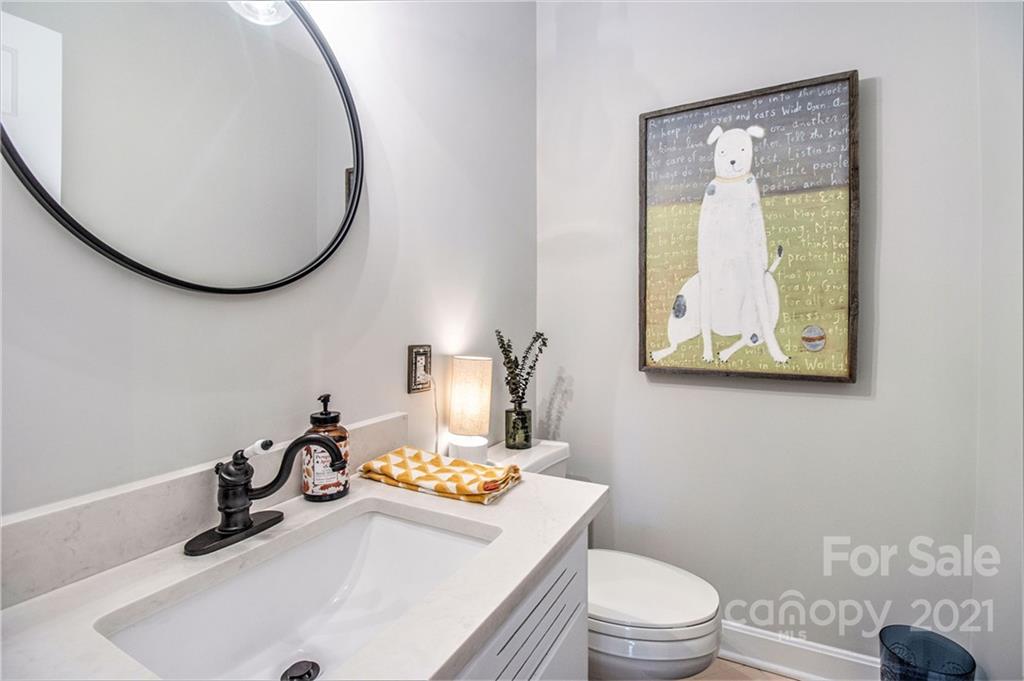 3513 Highview Road Charlotte, NC 28210 - Photo 13 of 27 a bathroom with a sink a toilet and mirror