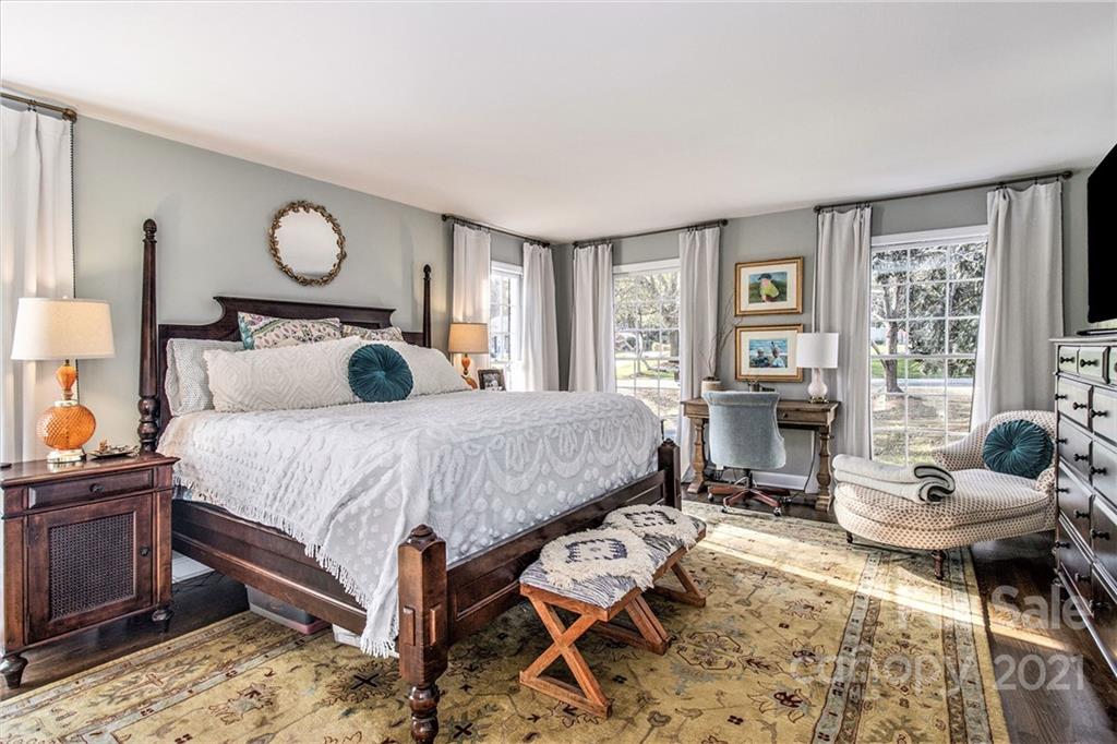 3513 Highview Road Charlotte, NC 28210 - Photo 14 of 27 a bedroom with a bed and wooden floor