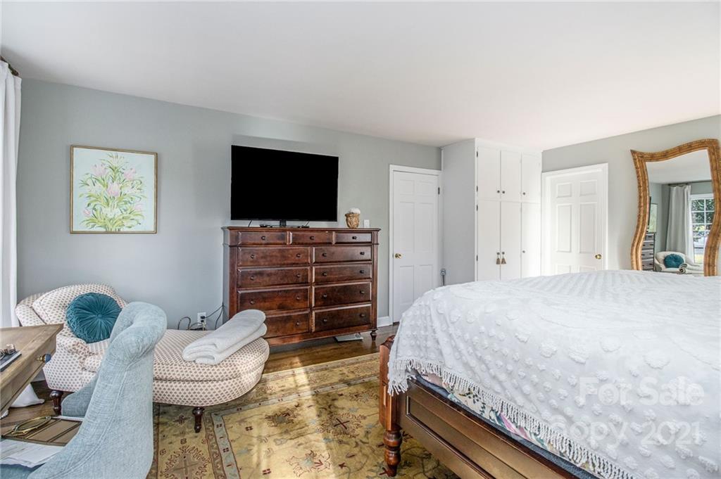 3513 Highview Road Charlotte, NC 28210 - Photo 15 of 27 a bedroom with a bed and a flat screen tv