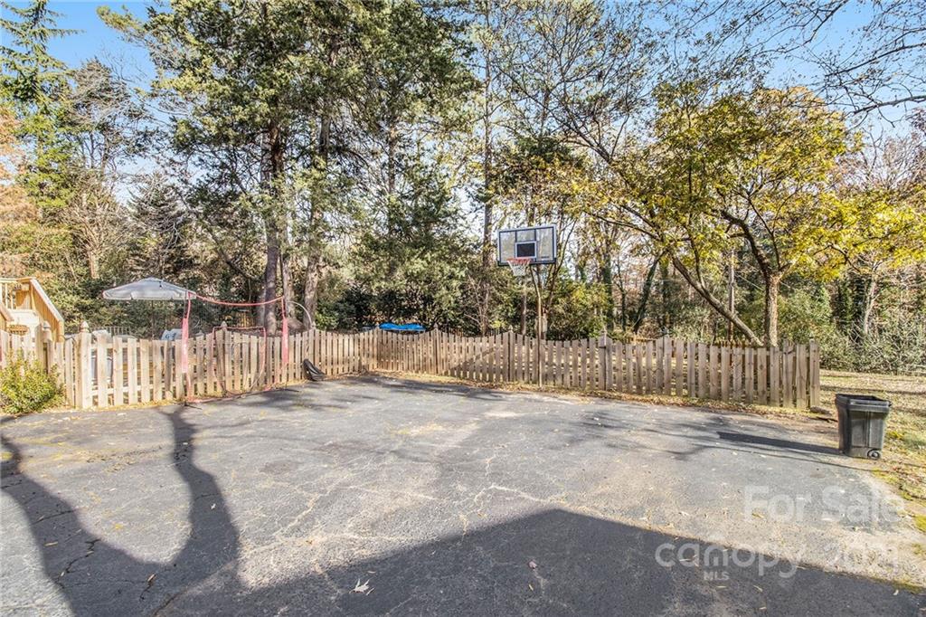 3513 Highview Road Charlotte, NC 28210 - Photo 24 of 27 a view of a yard with a bench and trees