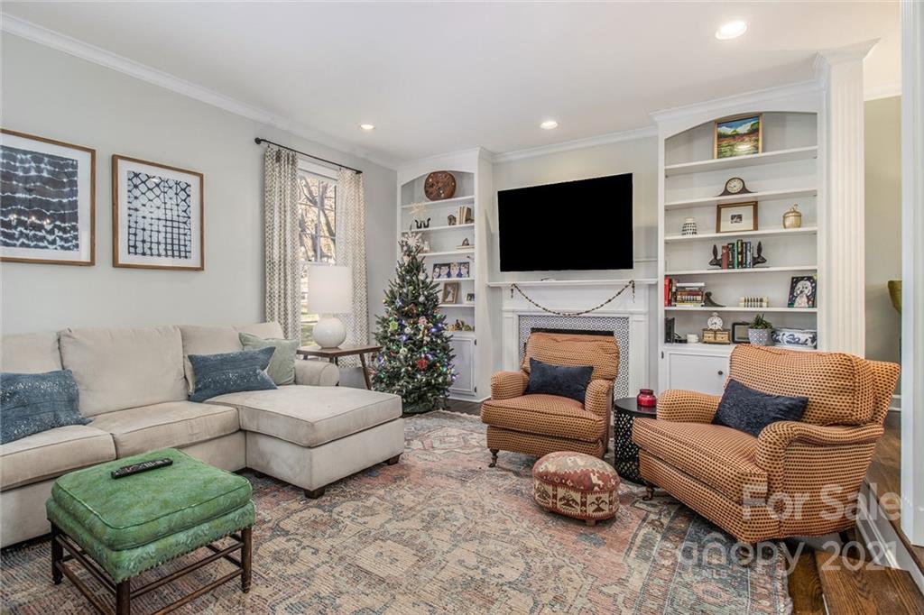 3513 Highview Road Charlotte, NC 28210 - Photo 4 of 27 a living room with furniture a flat screen tv and a fireplace