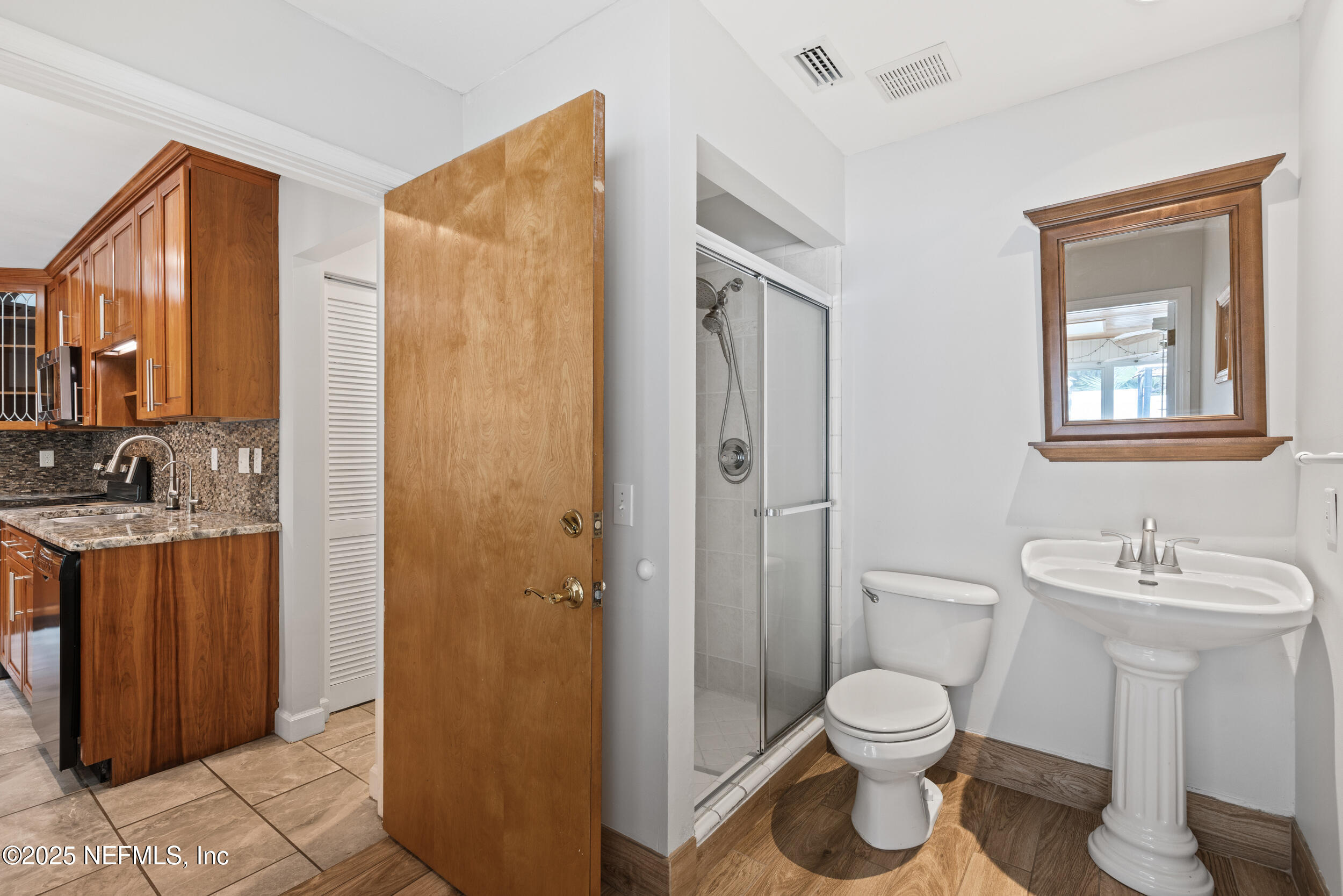 49 Nelsons Point Keystone Heights, FL 32656 - Photo 14 of 34 a bathroom with a toilet sink and shower