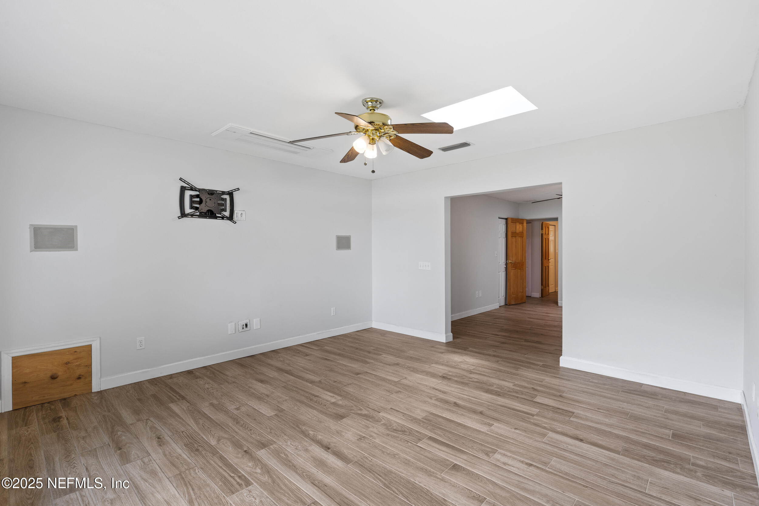 49 Nelsons Point Keystone Heights, FL 32656 - Photo 21 of 39 a view of a room with wooden floor and a ceiling fan