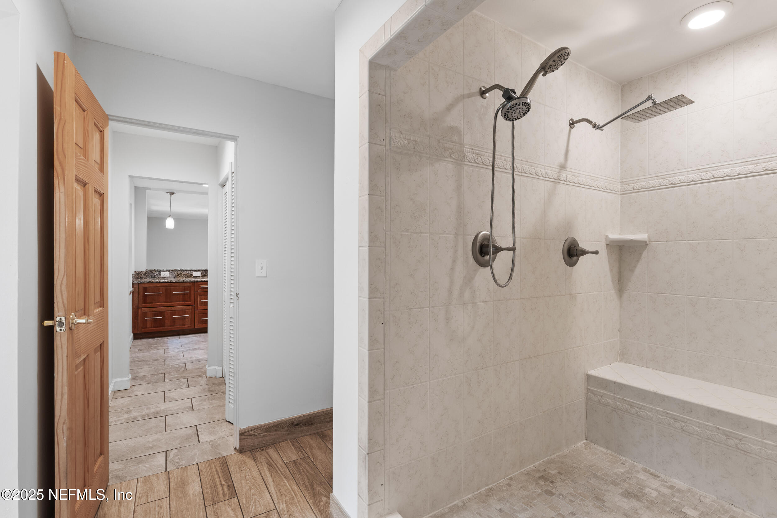 49 Nelsons Point Keystone Heights, FL 32656 - Photo 21 of 34 a bathroom with a glass shower door