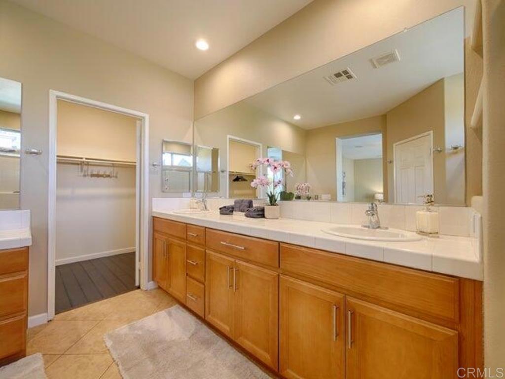 80596 Key Largo Avenue Indio, CA 92201 - Photo 15 of 59 a spacious bathroom with a mirror sink and shower