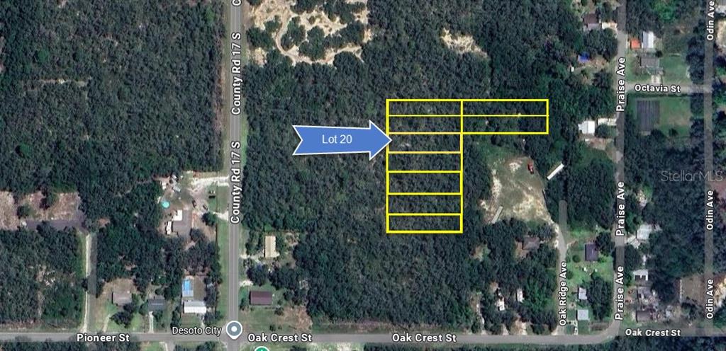 6101 Oak Ridge Avenue, Unit LOT 20 Sebring, FL 33876 - Photo 2 of 13 a green building with trees in front of it