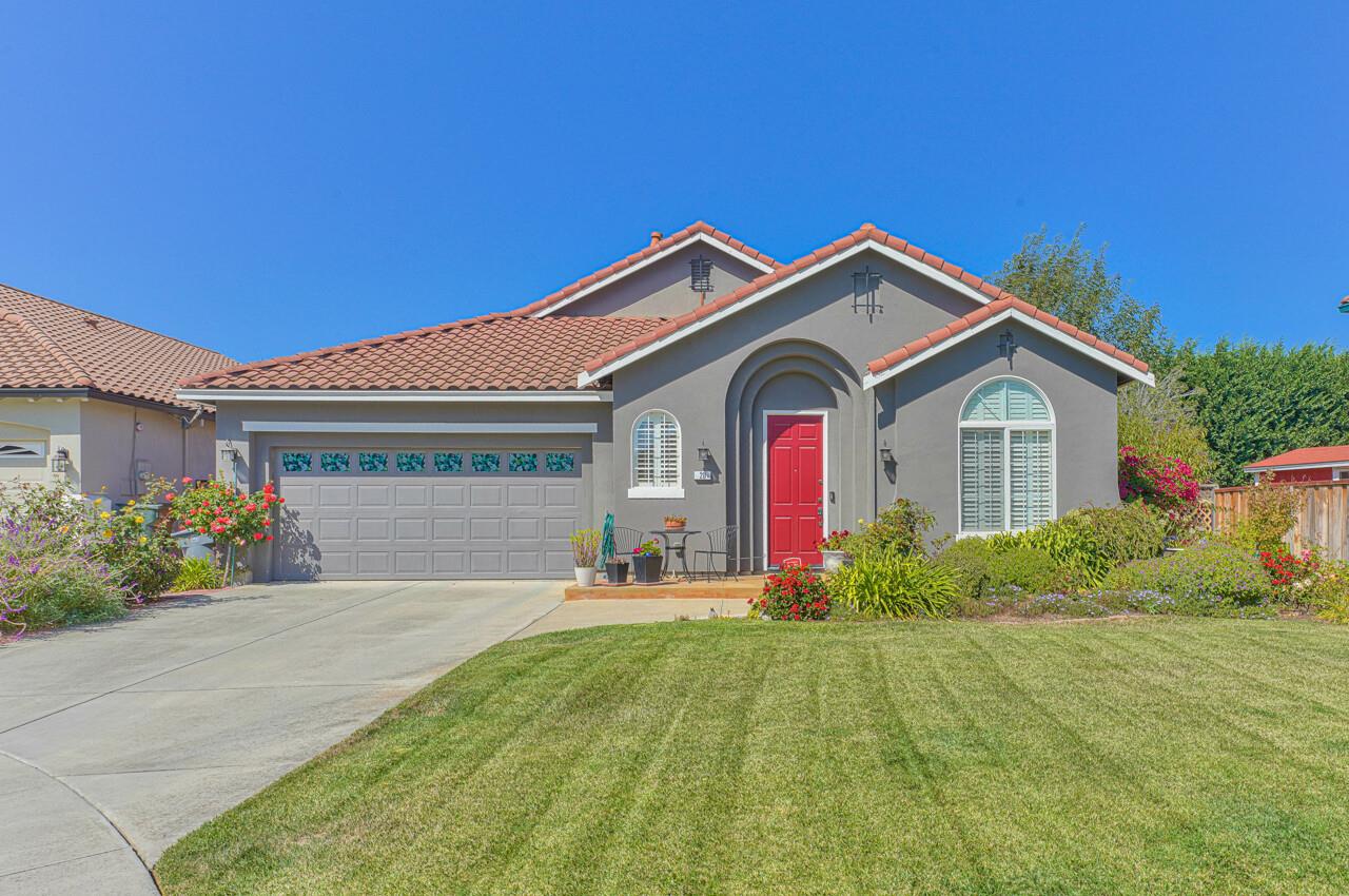 a front view of a house with garden