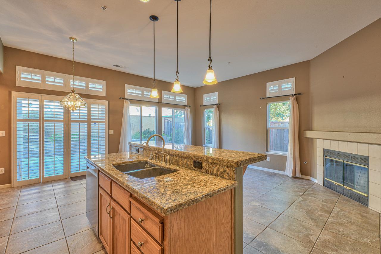 20 Glen Falls Circle Salinas, CA 93906 - Photo 12 of 37 a kitchen with granite countertop sink stove and refrigerator