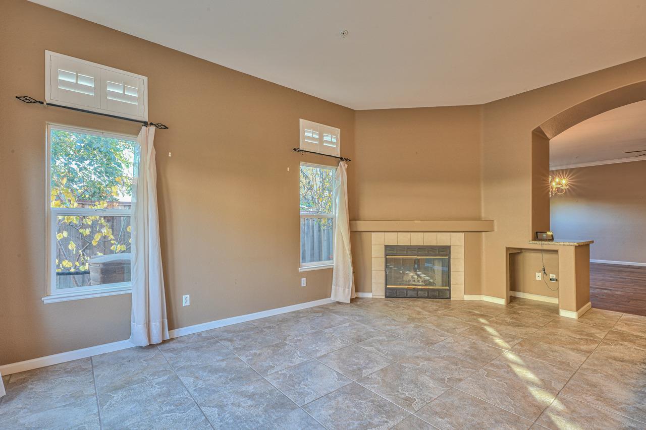 20 Glen Falls Circle Salinas, CA 93906 - Photo 14 of 37 an empty room with windows and fireplace