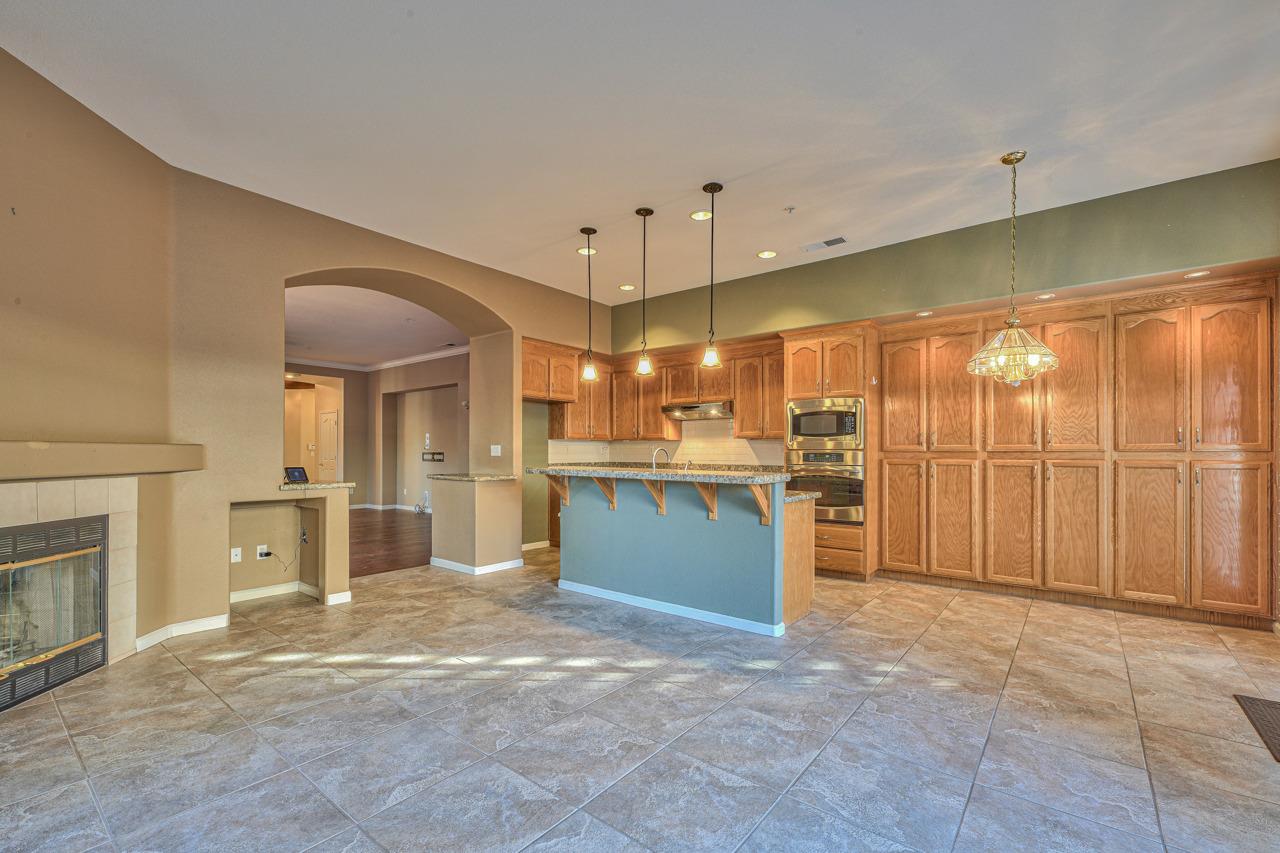 20 Glen Falls Circle Salinas, CA 93906 - Photo 15 of 37 a view of a kitchen with a sink and a fireplace