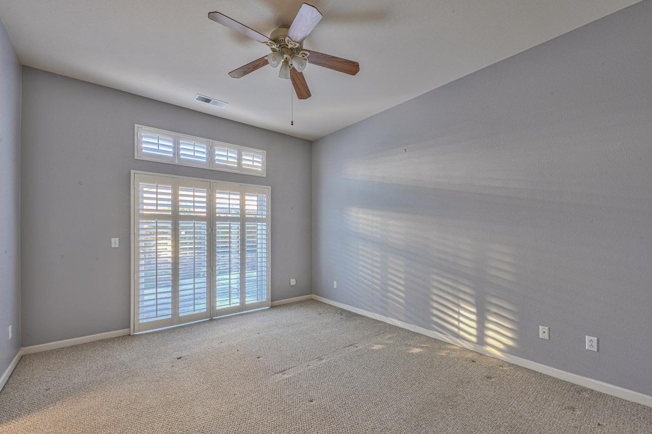 20 Glen Falls Circle Salinas, CA 93906 - Photo 21 of 37 en empty room with windows and ceiling fan