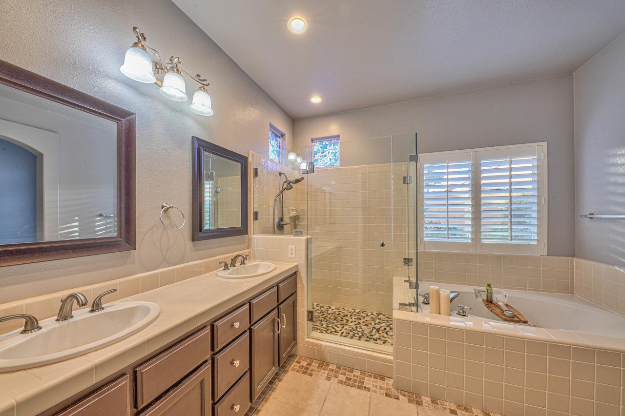 20 Glen Falls Circle Salinas, CA 93906 - Photo 25 of 37 a spacious bathroom with a double vanity sink mirror and bathtub