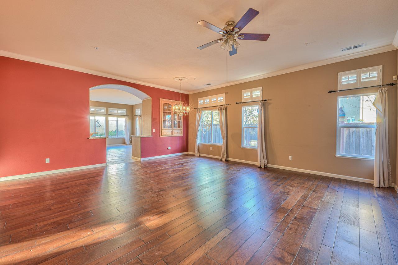 20 Glen Falls Circle Salinas, CA 93906 - Photo 5 of 37 a view of an empty room with window and wooden floor