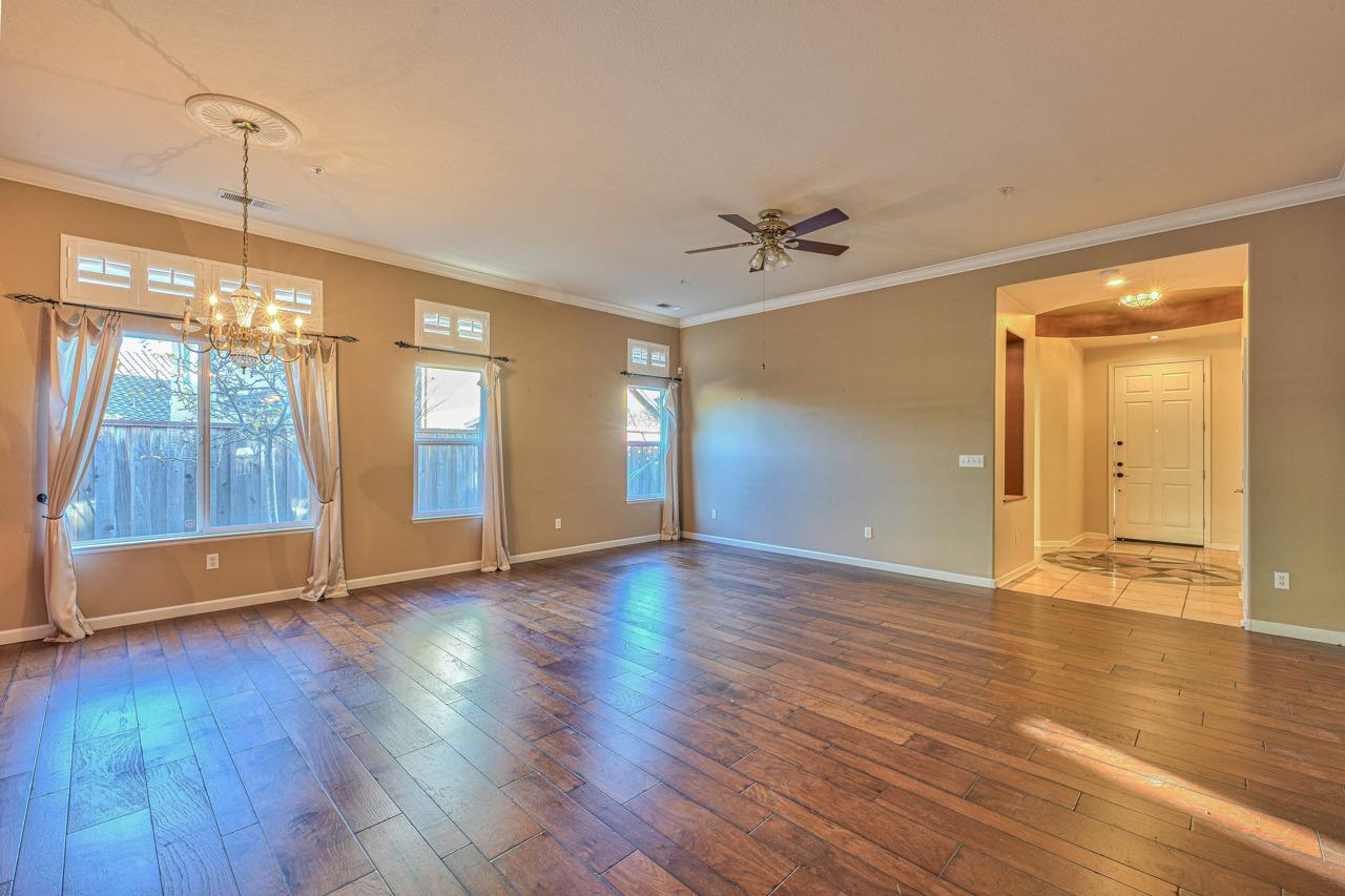 20 Glen Falls Circle Salinas, CA 93906 - Photo 6 of 37 a view of an empty room with wooden floor and a window