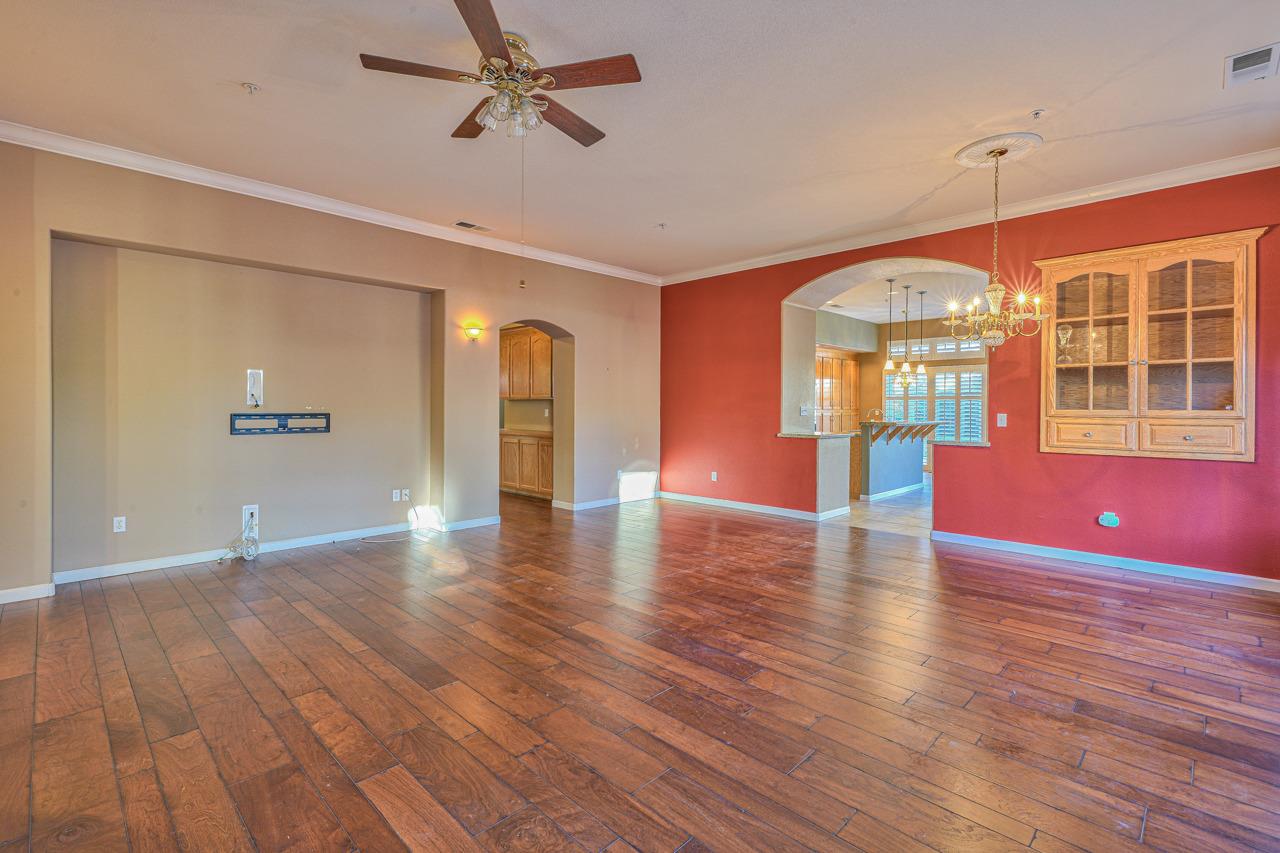 20 Glen Falls Circle Salinas, CA 93906 - Photo 7 of 37 an empty room with wooden floor and windows