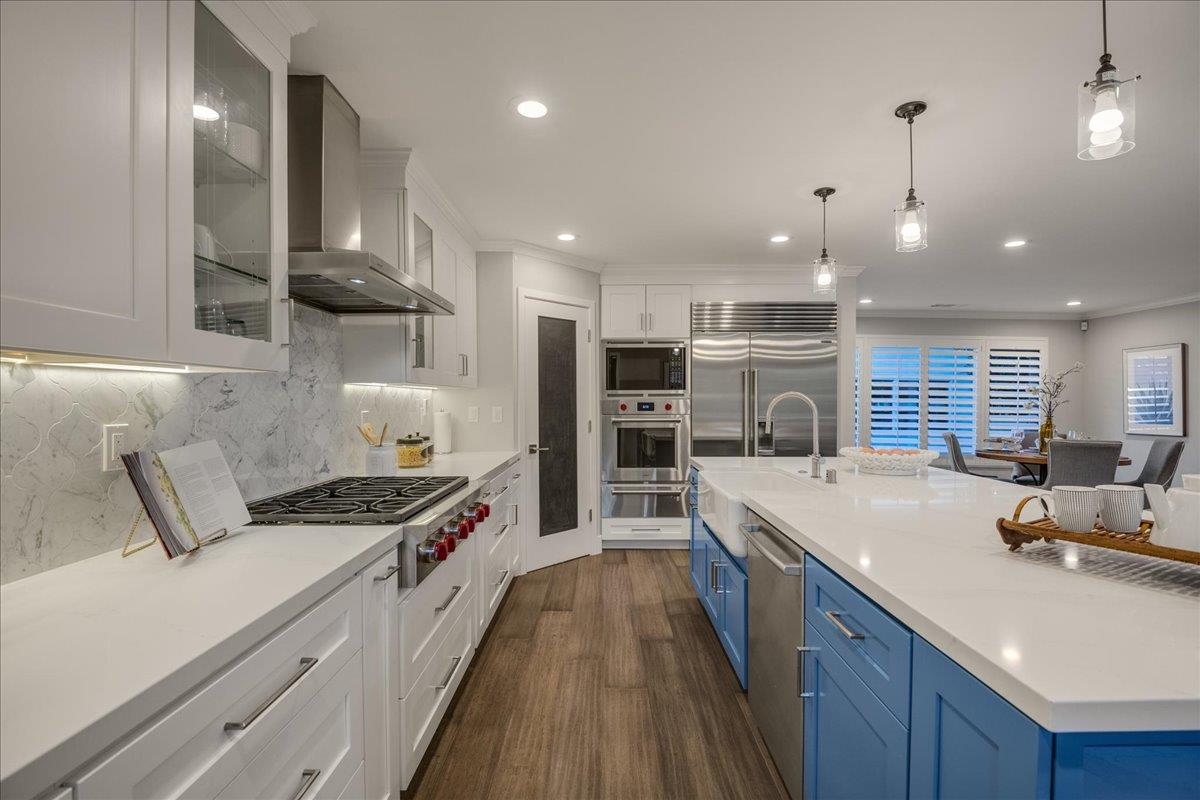 1450 Padres Drive San Jose, CA 95125 - Photo 19 of 52 a kitchen with stainless steel appliances a sink a stove top oven a counter space and cabinets