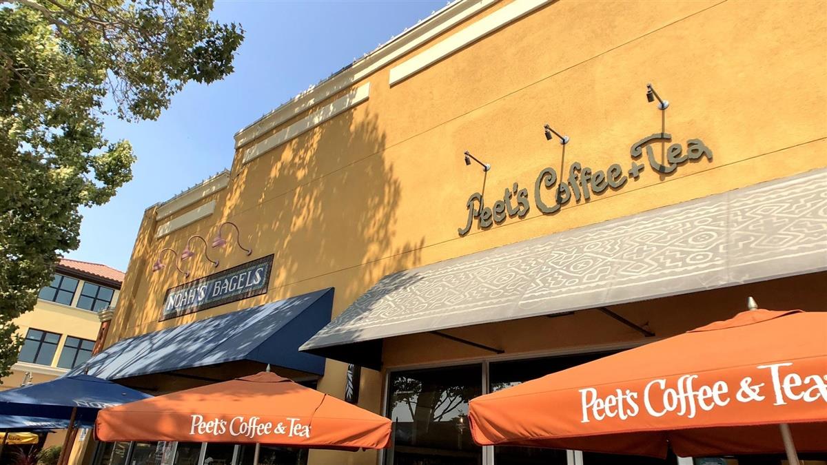 1450 Padres Drive San Jose, CA 95125 - Photo 47 of 52 a view of a cafe with a table and chairs under an umbrella