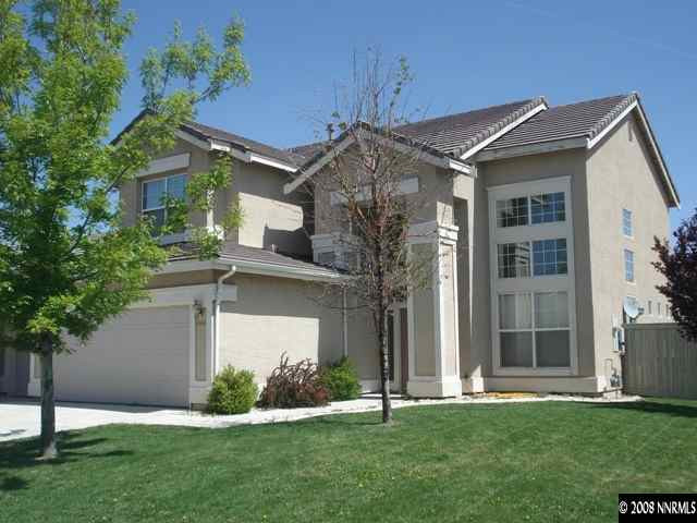 9590 Apache Rose Drive Reno, NV 89521 - Photo 1 of 9 front view of a house with a yard
