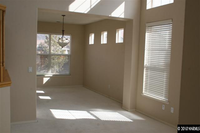 9590 Apache Rose Drive Reno, NV 89521 - Photo 4 of 9 a view of an empty room with a window