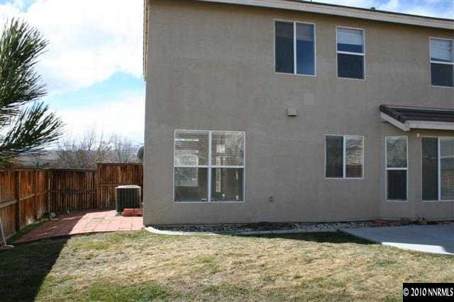 9590 Apache Rose Drive Reno, NV 89521 - Photo 9 of 9 a view of a house with backyard and sitting area