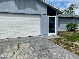 a view of a house with a garage