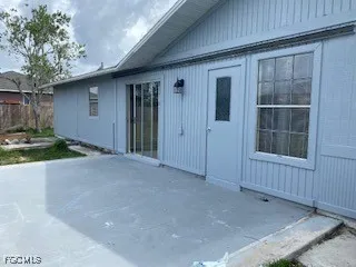 a view of an empty room with windows