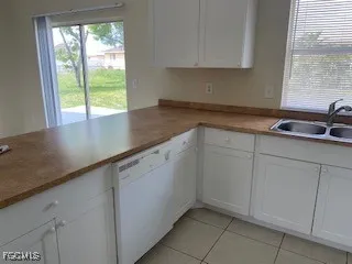 a kitchen with a sink and cabinets