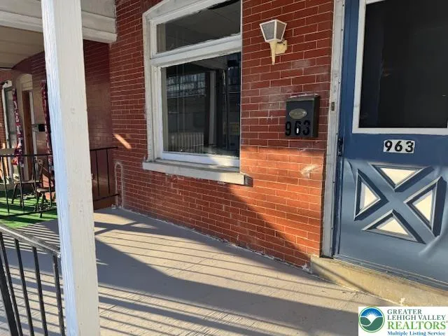 a view of a door of a house with a door and a street