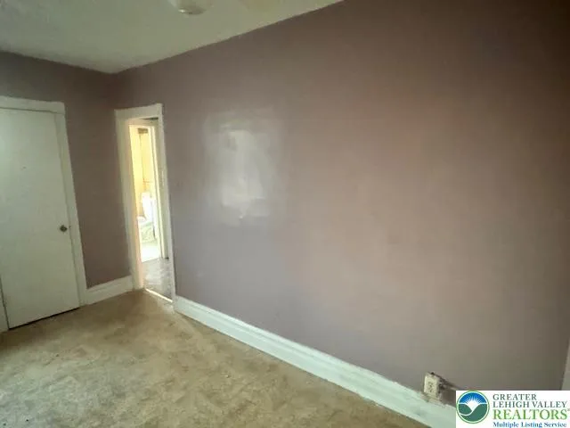 a view of an empty room and window