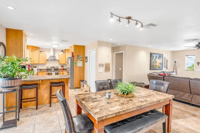 a view of a dining table and chairs in the kitchen