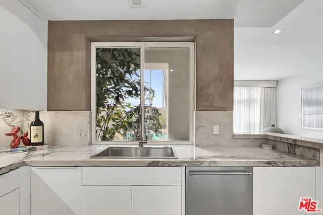 a kitchen with a sink and a window