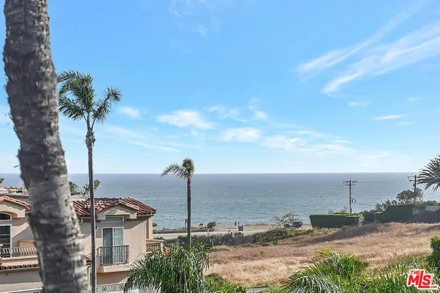 a view of a swimming pool with a lake view
