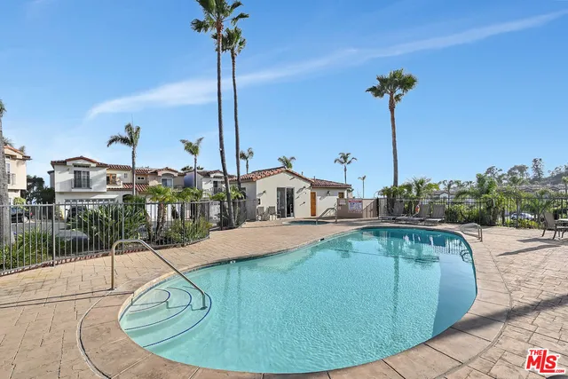 a view of a swimming pool with a yard