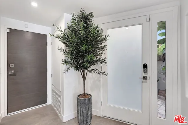 a vase of flowers sitting next to a bathroom