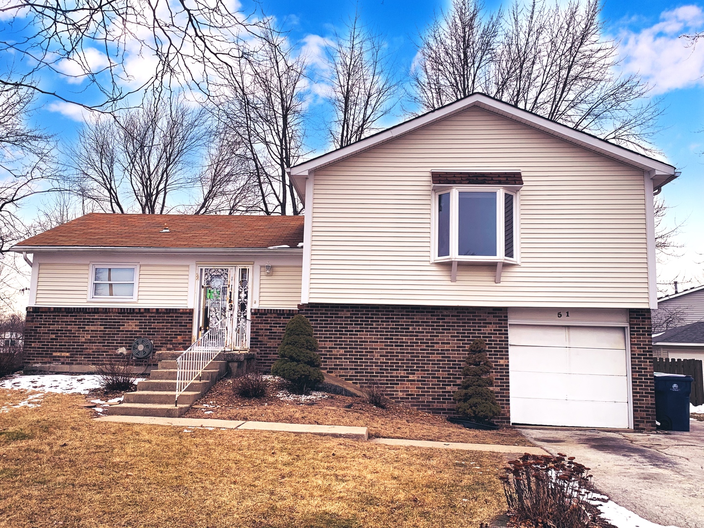 51 Wedgewood Road Matteson, IL 60443 - Photo 1 of 1 a front view of a house with a yard