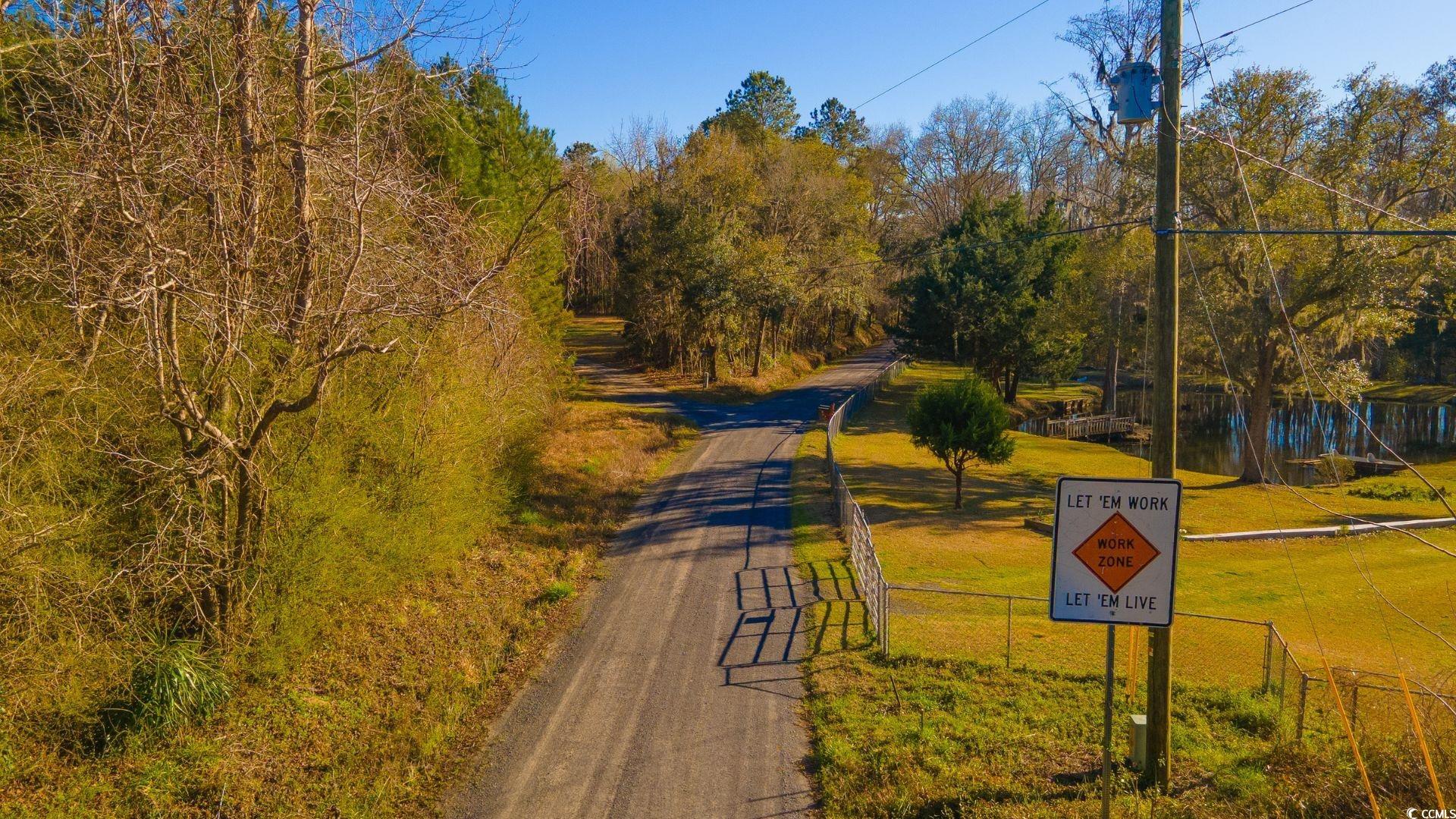 0 Corner Loop Road Georgetown, SC 29440 - Photo 7 of 10 View of road featuring a water view