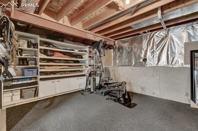 8460 Tibbs Road Peyton, CO 80831 - Photo 29 of 37 Built in storage shelves in basement