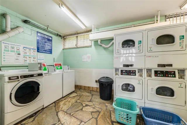 a utility room with dryer washer and other items