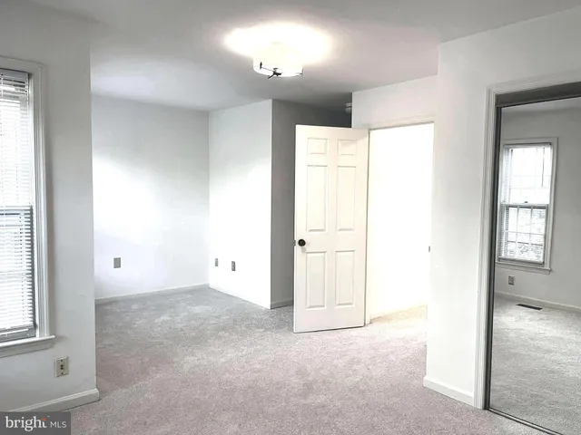 a view of staircase with rug