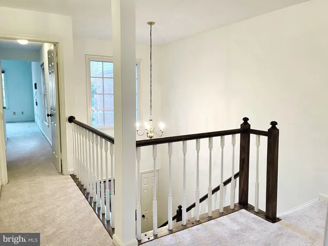 a view of a bathroom with a sink and a mirror